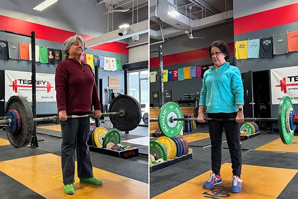 two lifters wrap up their deadlifts at testify