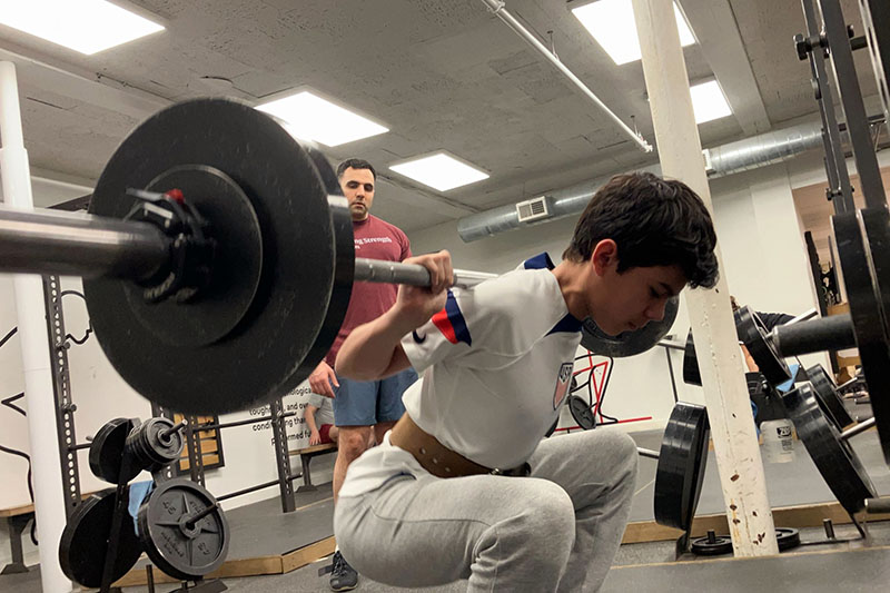 adrian at the bottom of a 100 lb squat