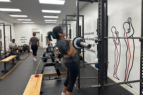 harika pushes her hips forward in the press