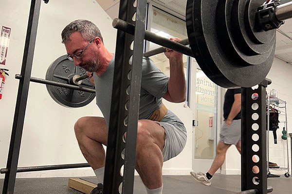 simon at the bottom of a 300lb squat pr