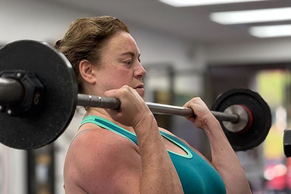 lifter at the top of a curl