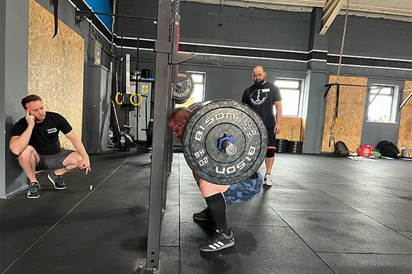 coaches watch darroll's squat position