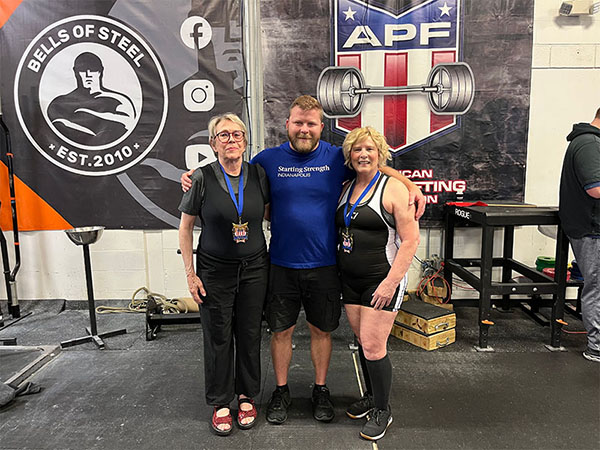 group photo with foster, lewis, and lynn at the powerlifting meet