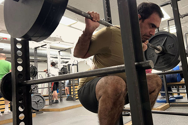 zakir at the bottom of a pr set of squats