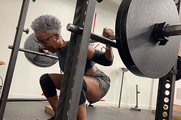 jacquie at the bottomo of a pr squat
