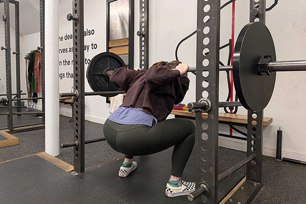 emily at the bottom of a squat