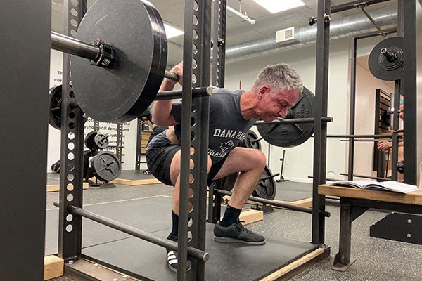 brian at the bottom of a 225 squat