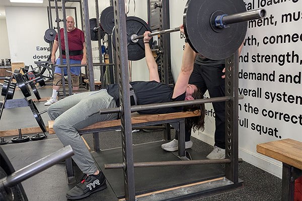alex bench pressing at the columbus gym
