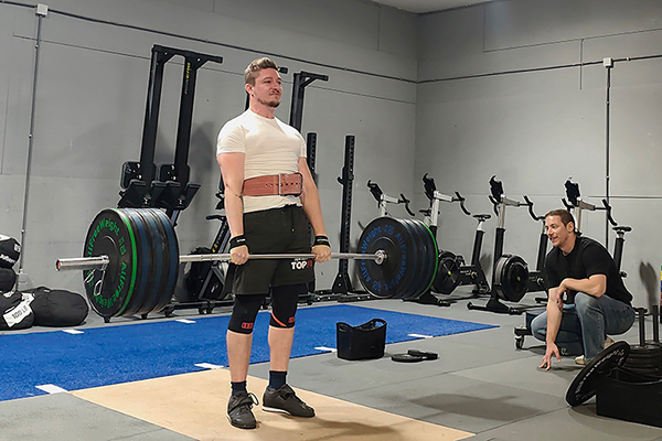 romeo locks out the last rep of a set of deadlifts