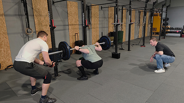 georgios reaches for depth in the squat