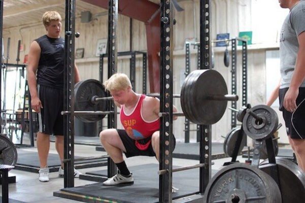 teenagers lifting weights