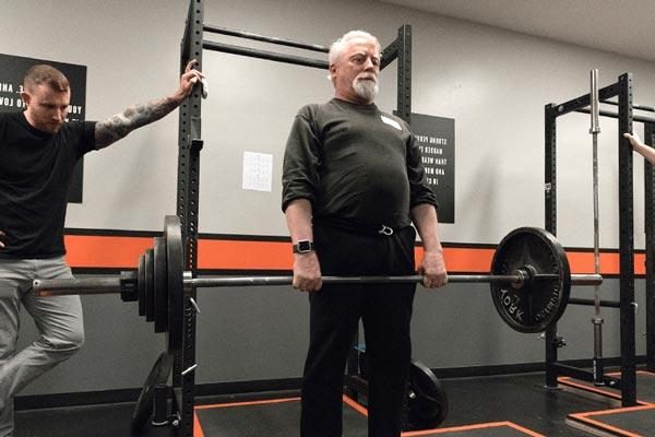 older man deadlifting