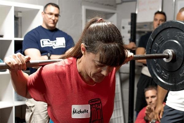 woman barbell squat