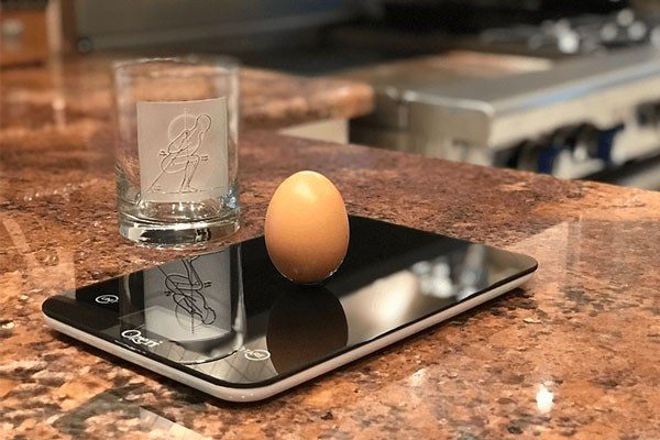egg balanced on a scale