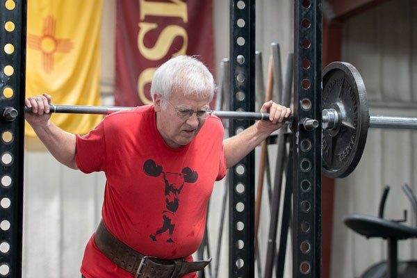 Phil Ringman at the top of a squat