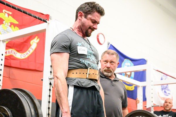rip coaching a deadlift at a starting strength seminar
