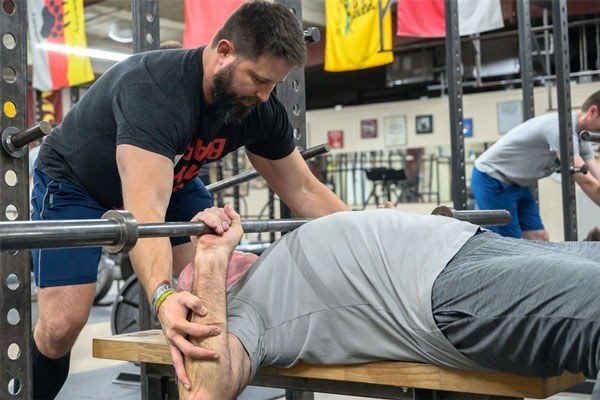 older man bench pressing