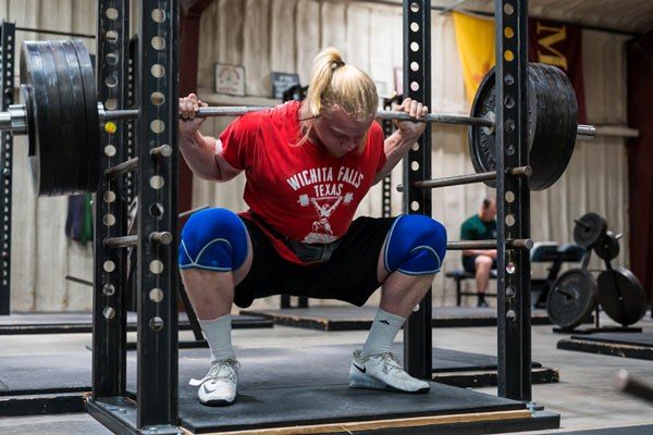 chase wearing knees sleeves in the squat