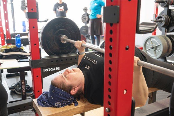 suri fineberg bench pressing at woodmere fitness club