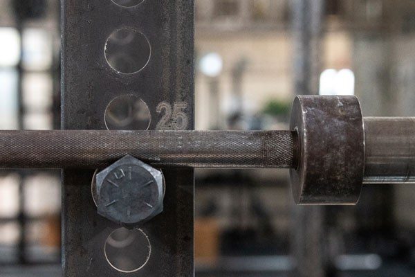 old barbell in a rack