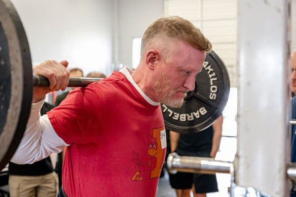 brad under the bar ready to squat