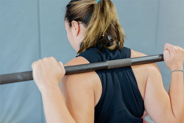 close up of bar placement in the squat