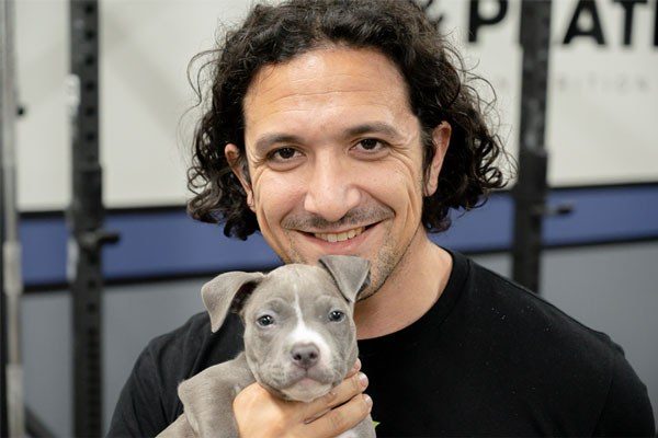 robert santana and june puppy at weights and plates gym