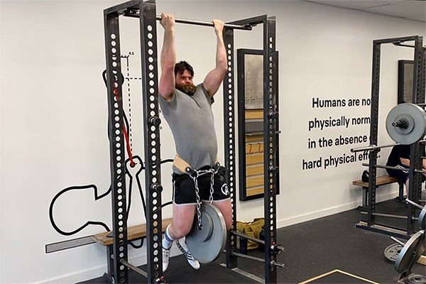 jim trains weighted chinups at starting strength denver