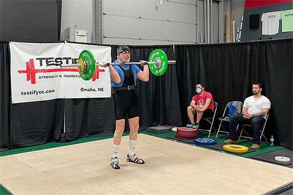 A racked clean at an Olympic weightlifting meet