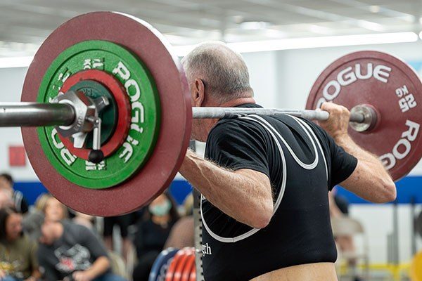 high bar squat in a strengthlifting meet