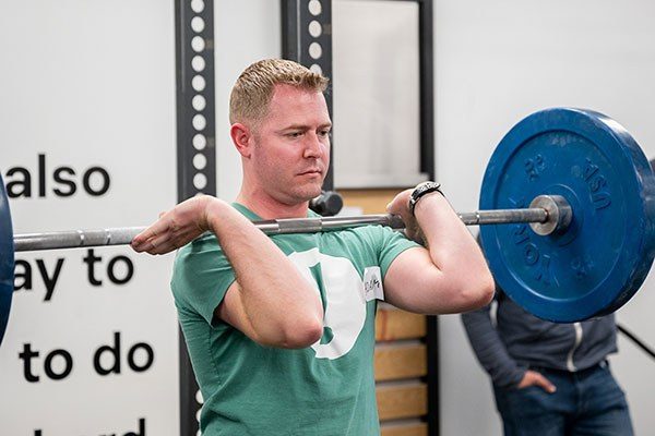 man holding a racked clean