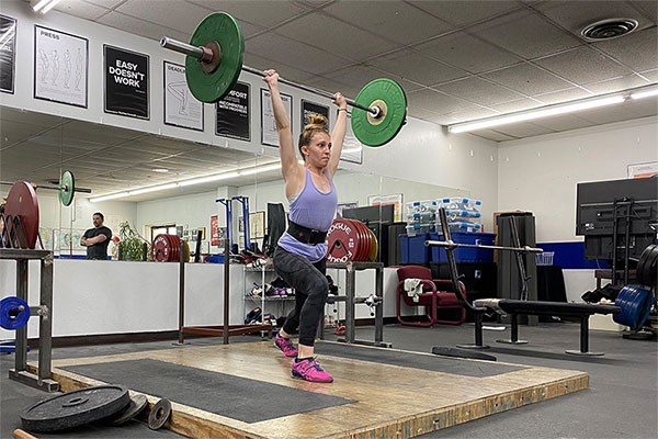 woman racking a split jerk