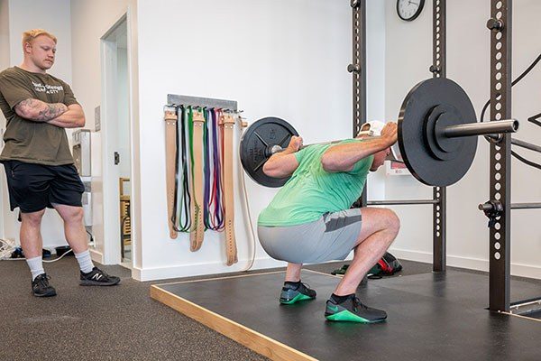 training the squat at a starting strength gym