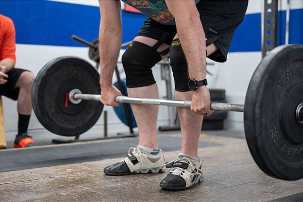 close up of the first pull of the power clean