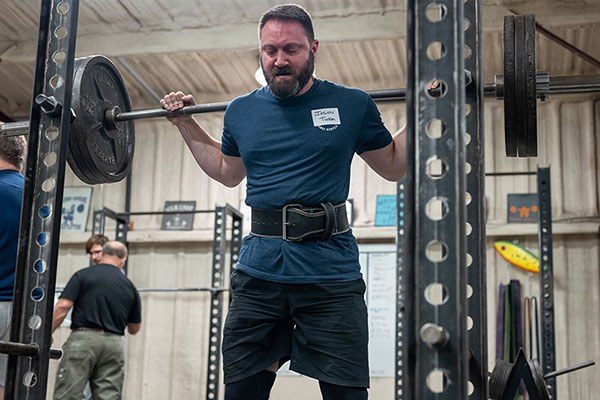 man standing at the top of a squat