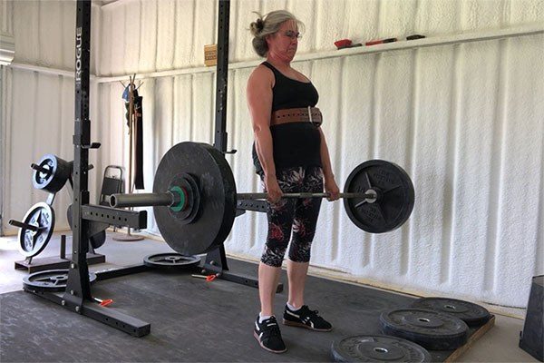 locking out a deadlift in a garage