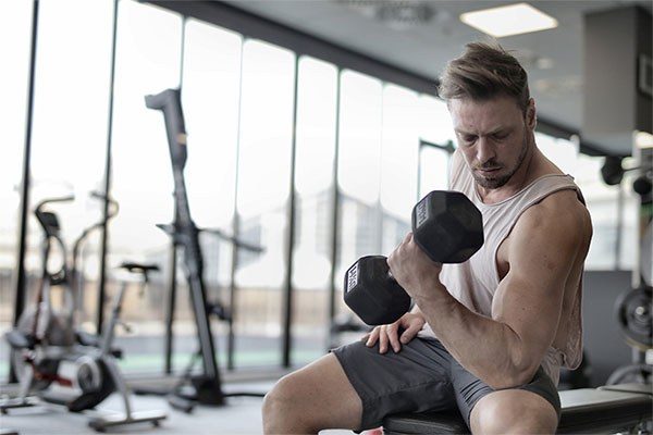 guy curling with a very light dumbbell