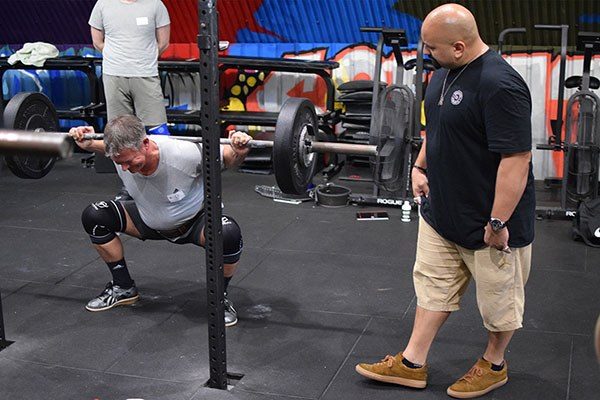 carl raghavan coaching the squat