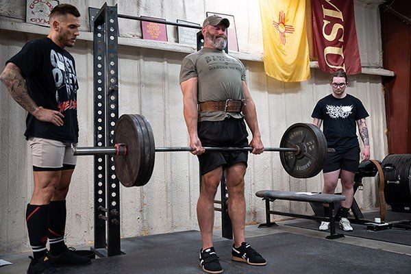 three lifters training the pull