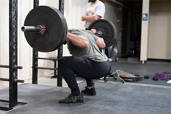 lifter at the bottom of a squat