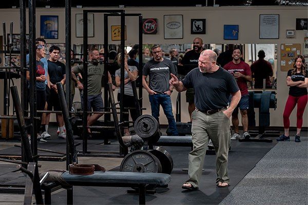 rip explains things to a group of lifters at a seminar