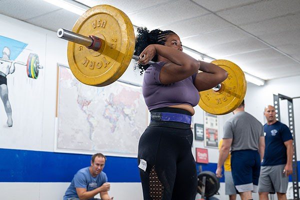 lifter at the top of a front squat