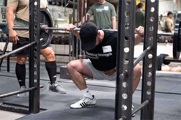 bottom of a squat with knees out