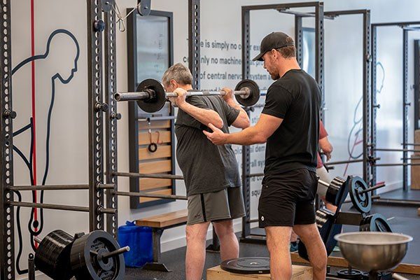 training the squat in a starting strength gym