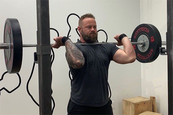 bar in the clean or front squat rack position