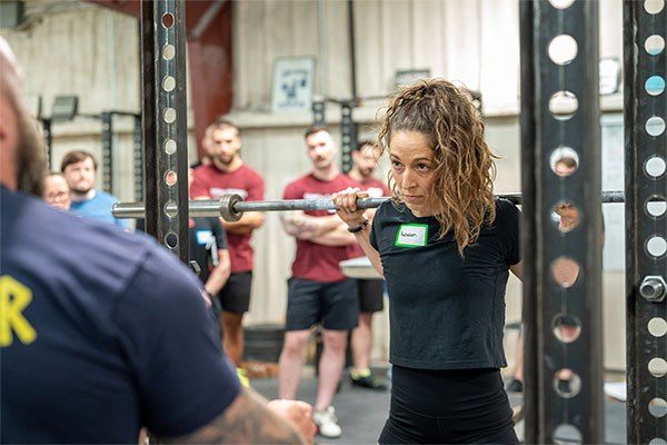 female lifter preparing to squat