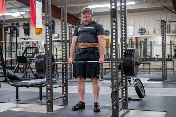 lifter training the rack pull assistance exercise