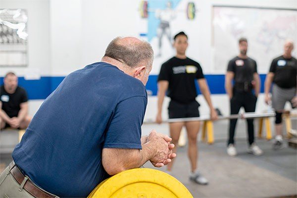 mark rippetoe coaches the clean at a starting strength seminar