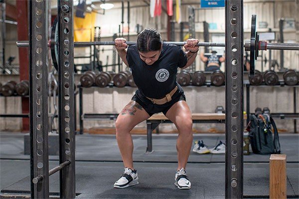 female lifter mid-squat