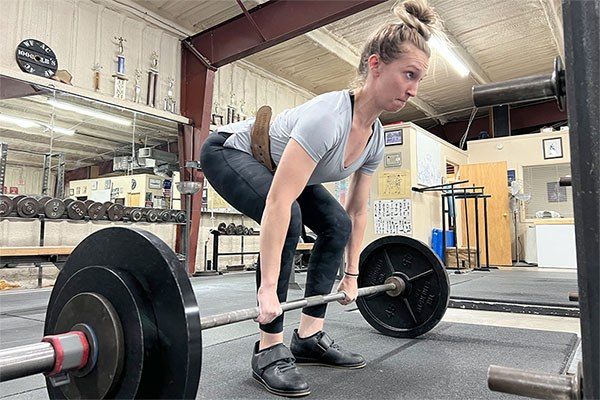 female at the deadlift start